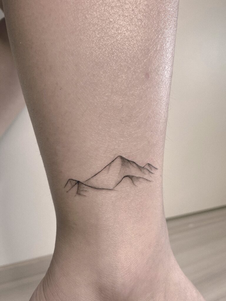 Helsinki-tattoo-Mayink-realistic-mountain-scaled.jpg
