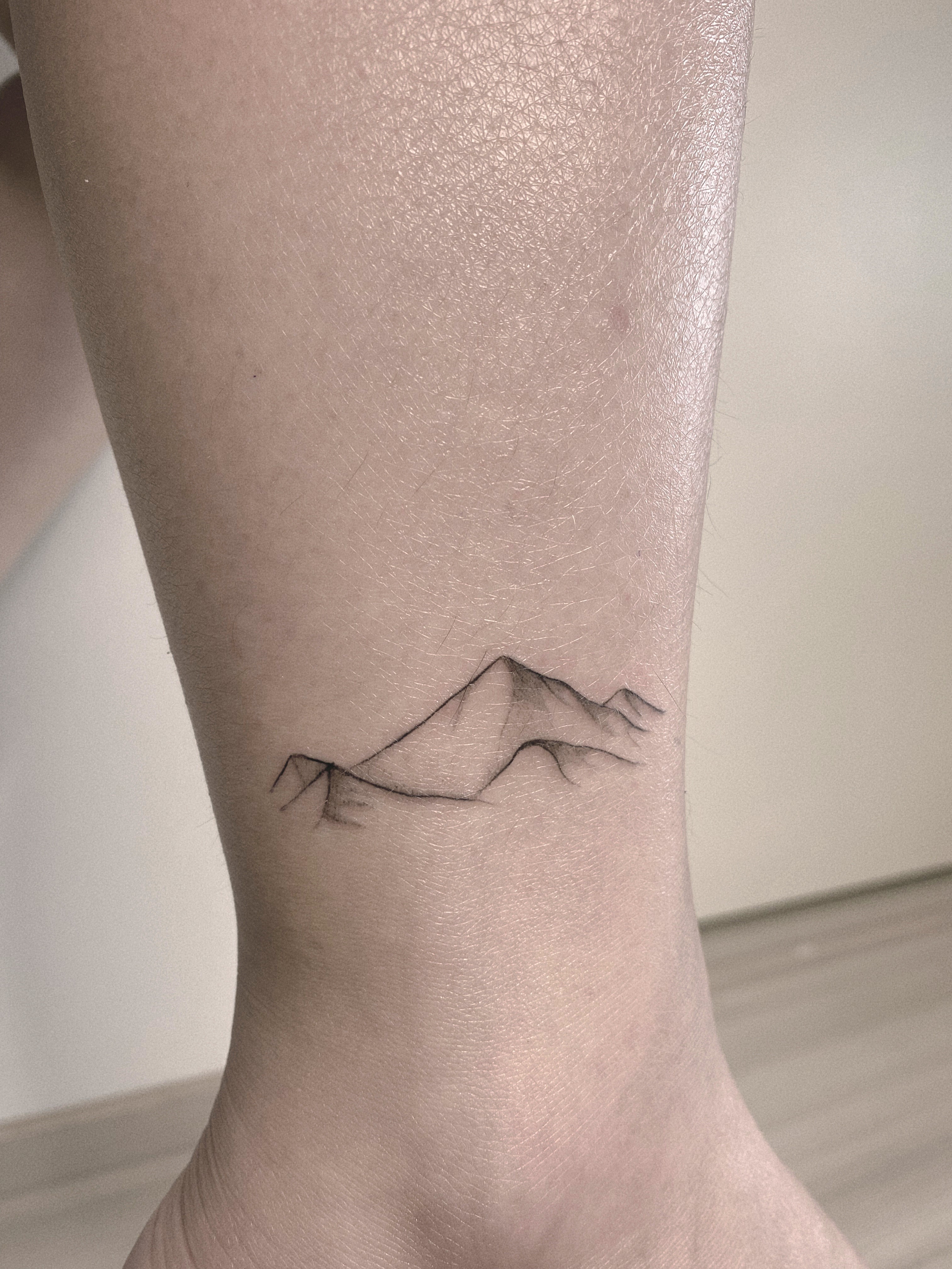 Helsinki-tattoo-Mayink-realistic-mountain-scaled.jpg