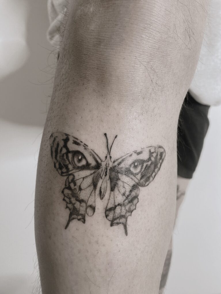 Tattoo-Helsinki-Realistic-Minirealism-butterfly-eyes-of-tiger-scaled.jpg