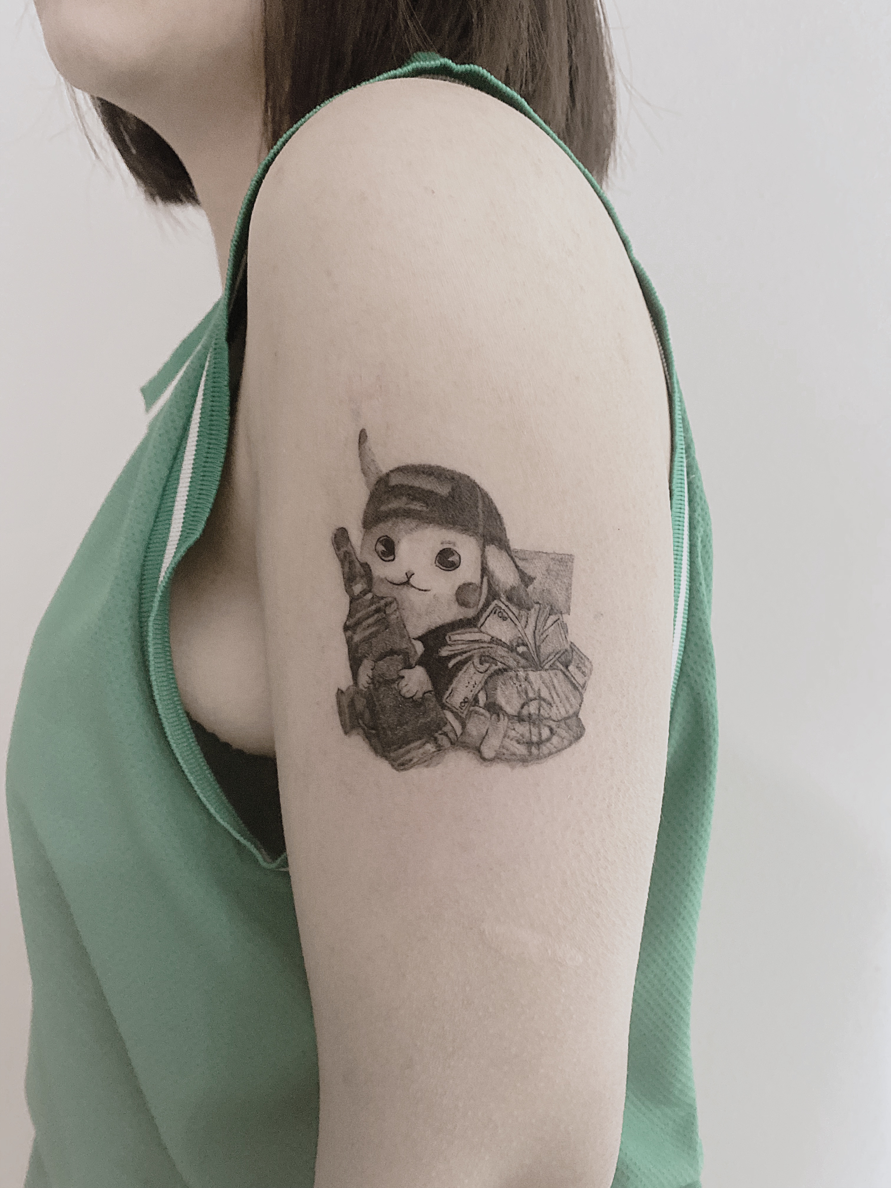 Tattoo-Helsinki-Realistic-Minirealism-pikachu-pokemon-gun-cute-scaled.jpg