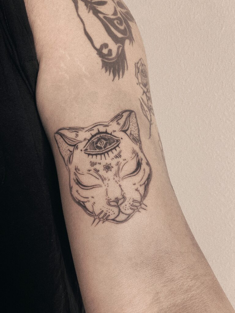 Tattoo-Helsinki-blackwork-cat-eyes-realistic-scaled.jpg