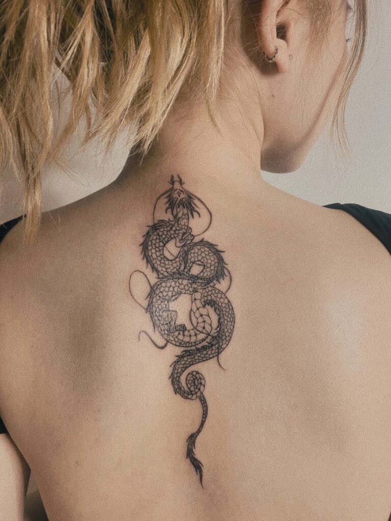 Tattoo-Helsinki-blackwork-dragon-back-realistic-scaled.jpg