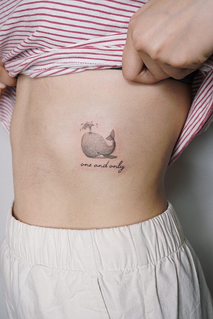 Tattoo-Helsinki-blackwork-whale-text.jpg