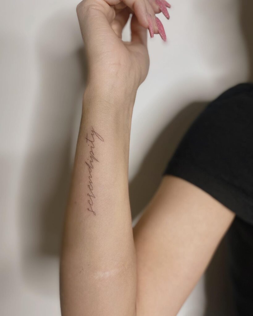 Tattoo-Helsinki-text-line-textwork-hand-vertical.jpg File type: image/jpeg