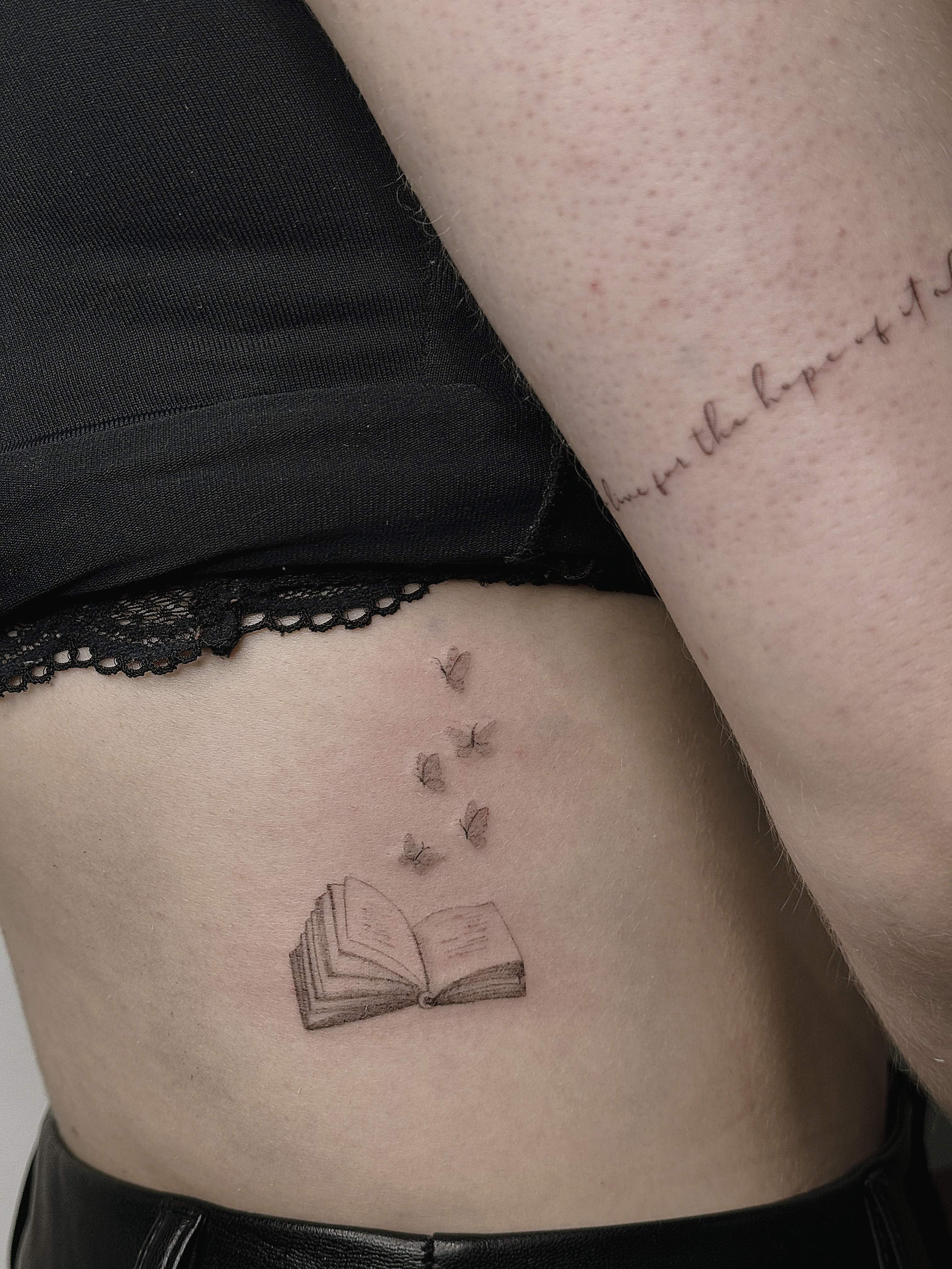 tattoohelsinki-book-and-butterflies-tattoo-realism-tattoo-scaled.jpg