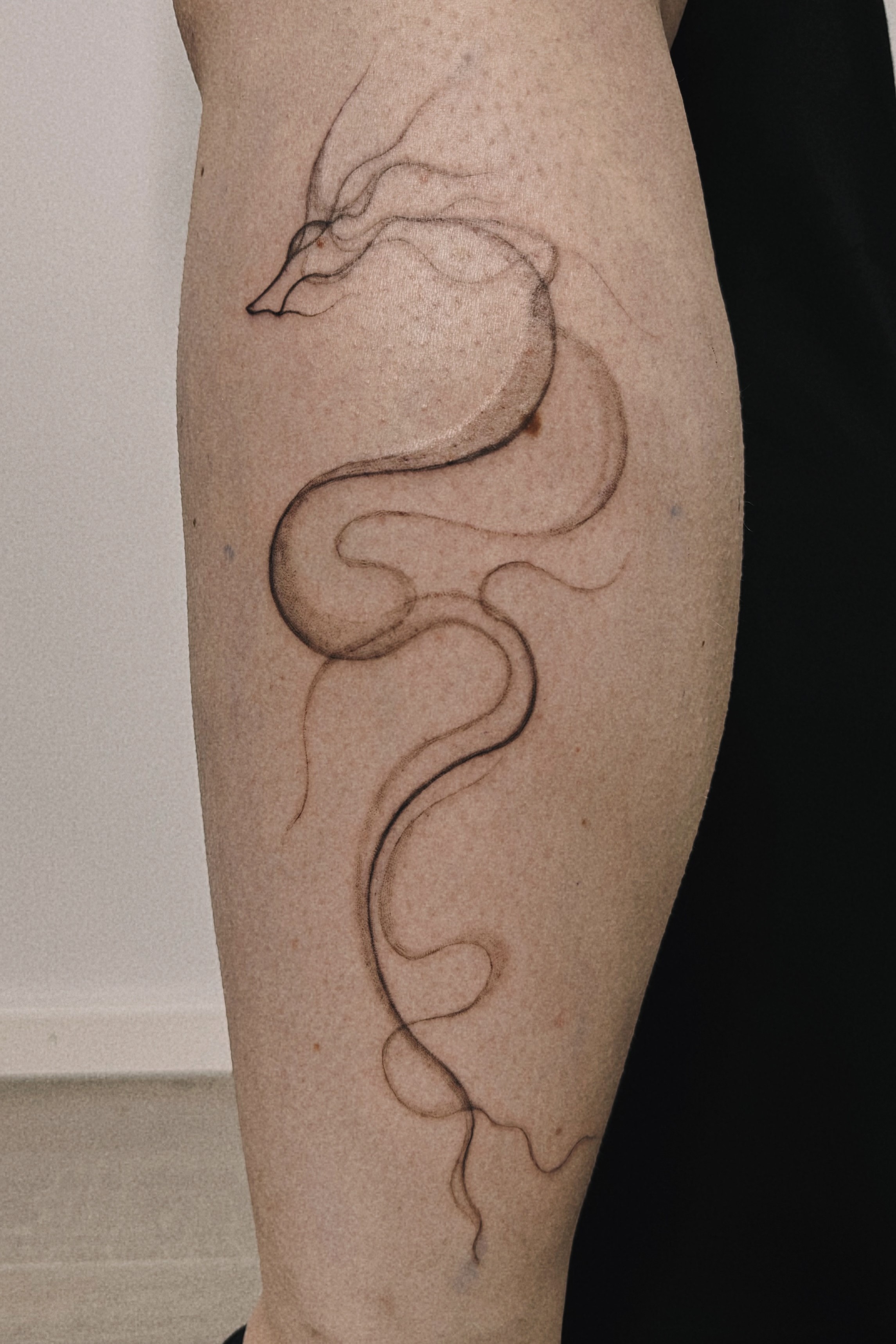 tattoohelsinki-dragon-smoke-abstract-tattoo-design-scaled.jpg