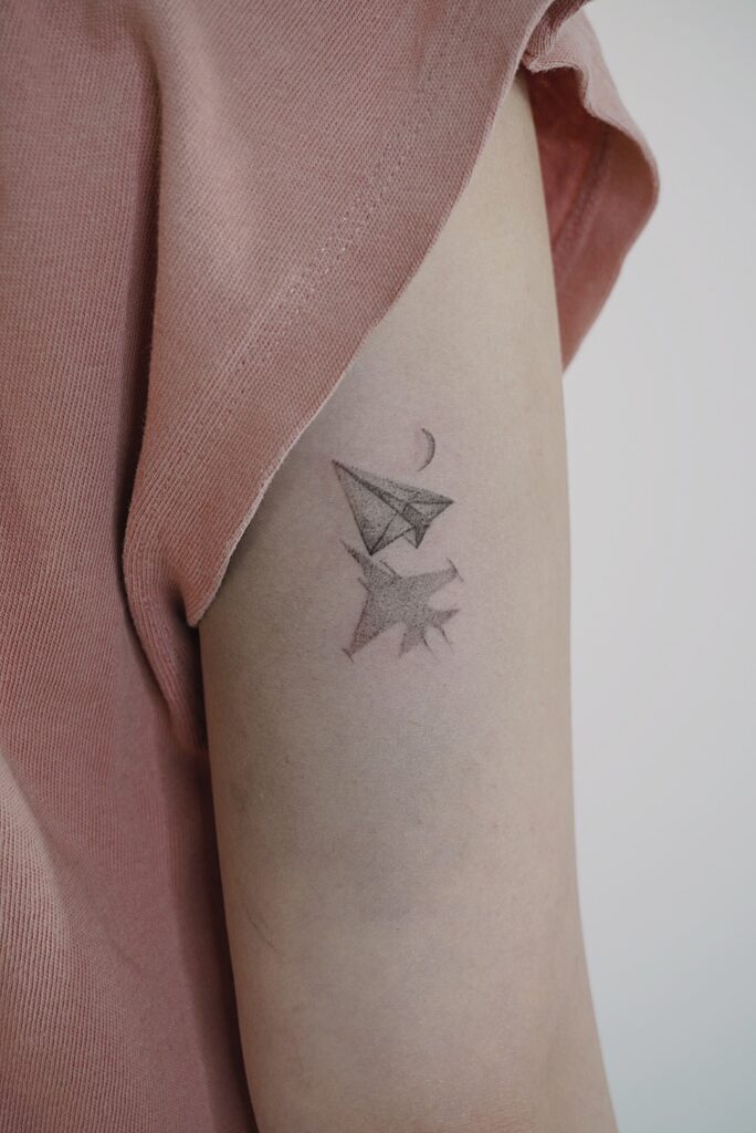 tattoohelsinki-paper-plane-realism-tattoo-design.jpg