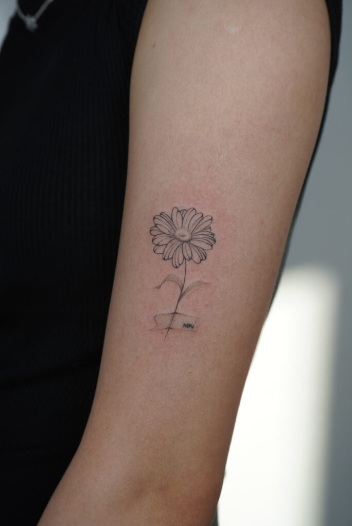 daisy tattoo